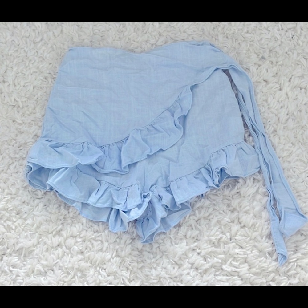Size 4 
Baby blue skirt shorts. Tie front